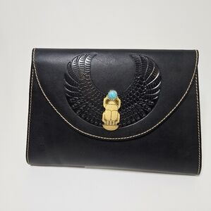 Hand-made cow leather clutch. And gold-plated scarab.
